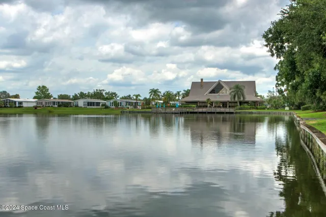 a view of a lake with a big yard