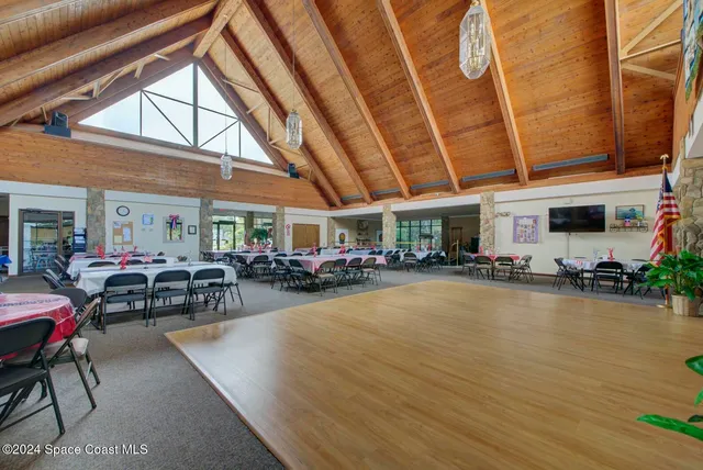 a view of a swimming pool with outdoor seating