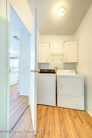 a utility room with washer and dryer