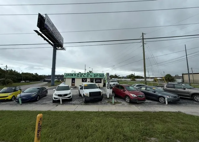 a couple of cars parked in a yard