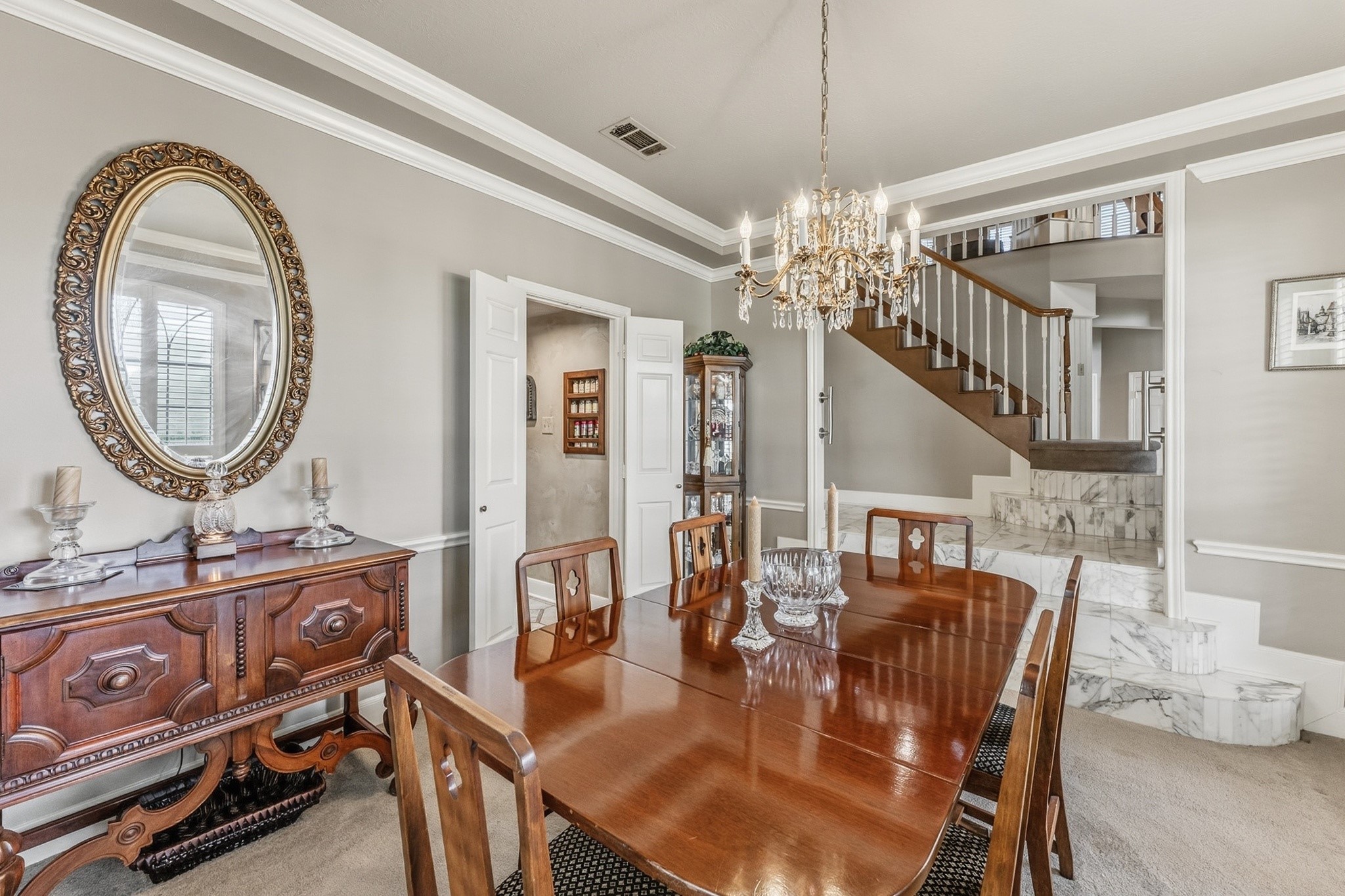 6047 Spring Creek Lane Spring, TX 77379 - Photo 14 of 50 Flowing seamlessly toward the kitchen, the dining space was designed for gatherings that linger long after dinner is served. Refined architectural accents and a graceful layout give the room a sense of timeless hospitality.