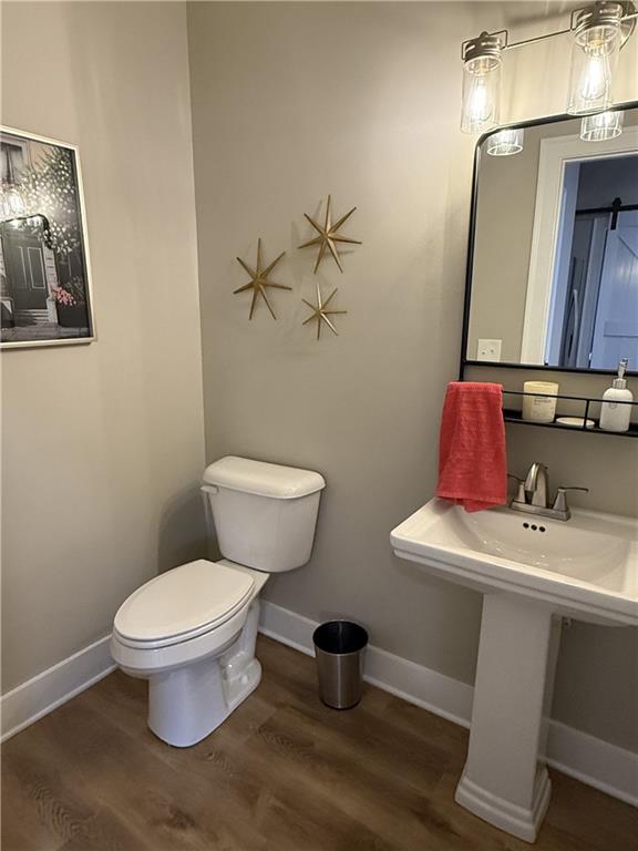 716 Manor Way, Unit 716 Cartersville, GA 30120 - Photo 12 of 21 a bathroom with a toilet sink and mirror