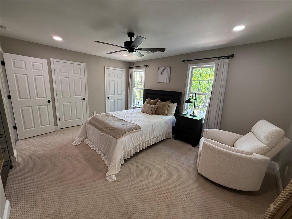 716 Manor Way, Unit 716 Cartersville, GA 30120 - Photo 14 of 21 a bedroom with a bed couch and window