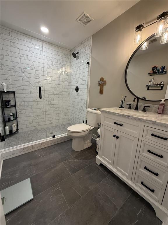 716 Manor Way, Unit 716 Cartersville, GA 30120 - Photo 15 of 21 a bathroom with a double vanity sink toilet and shower