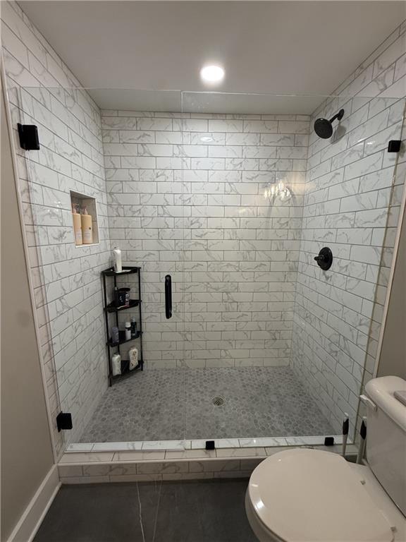 716 Manor Way, Unit 716 Cartersville, GA 30120 - Photo 16 of 21 a bathroom with a sink a toilet and shower