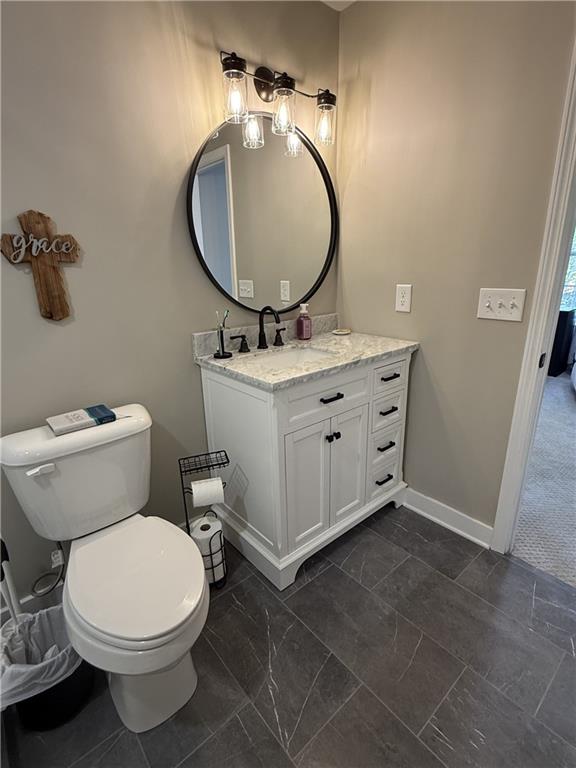 716 Manor Way, Unit 716 Cartersville, GA 30120 - Photo 17 of 21 a bathroom with a toilet mirror and sink