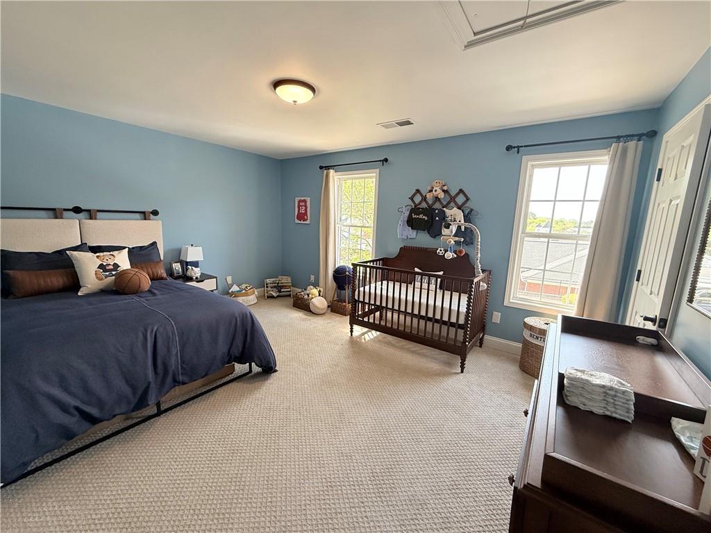 716 Manor Way, Unit 716 Cartersville, GA 30120 - Photo 19 of 21 a bedroom with a bed and a window