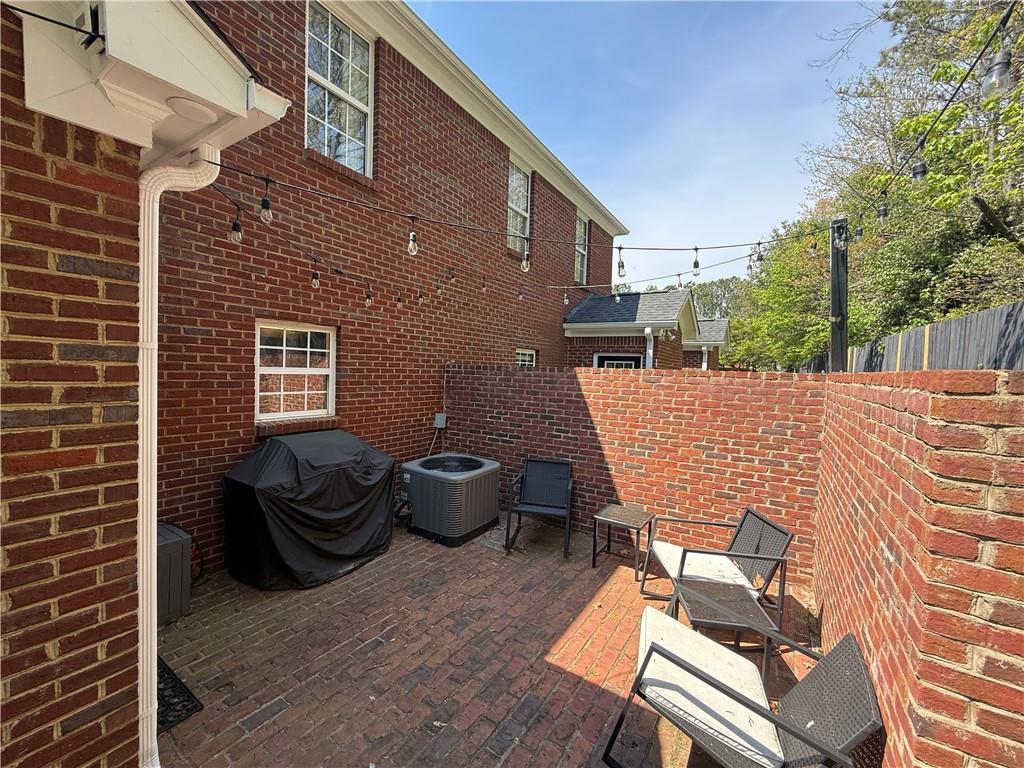 716 Manor Way, Unit 716 Cartersville, GA 30120 - Photo 3 of 21 a view of a patio with couches chairs and a potted plant