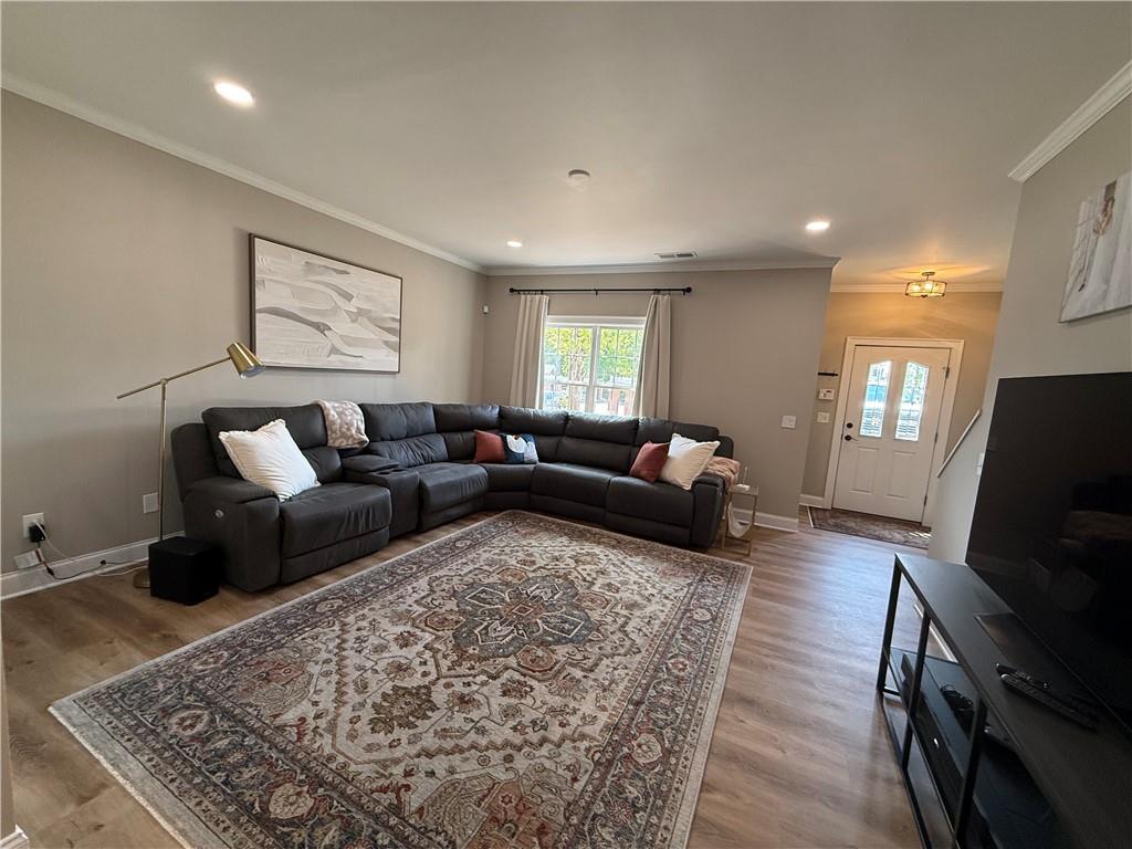 716 Manor Way, Unit 716 Cartersville, GA 30120 - Photo 6 of 21 a living room with furniture and a flat screen tv