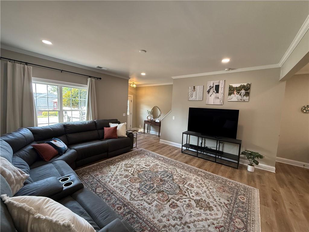 716 Manor Way, Unit 716 Cartersville, GA 30120 - Photo 7 of 21 a living room with furniture and a flat screen tv