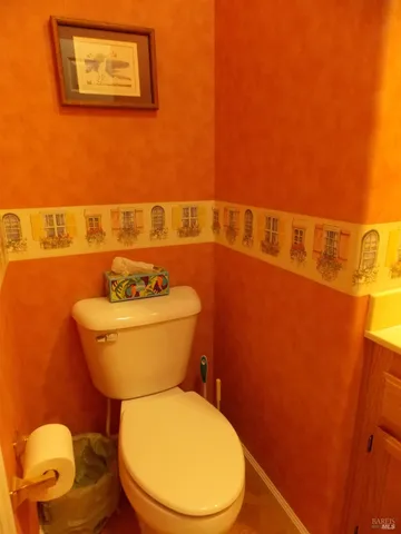 a bathroom with a toilet and a sink