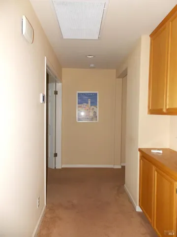 a view of a hallway with a bathroom