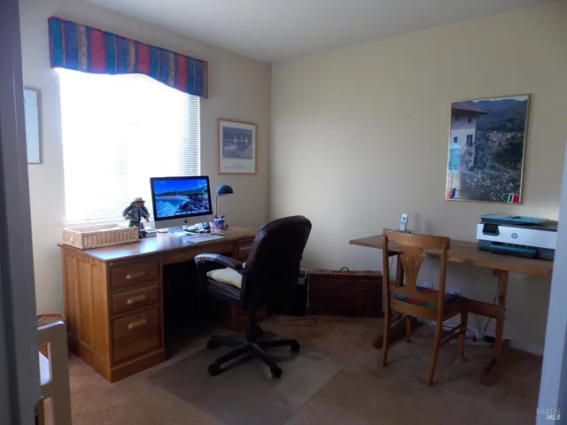 a view of a workspace with furniture