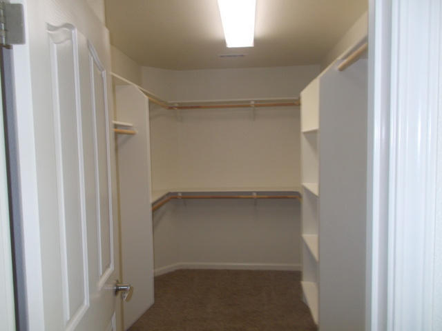 2649 Rhinestone Way Redding, CA 96001 - Photo 13 of 25 a view of an empty walk in closet