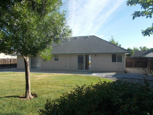 2649 Rhinestone Way Redding, CA 96001 - Photo 19 of 25 a house that has tree in front of it