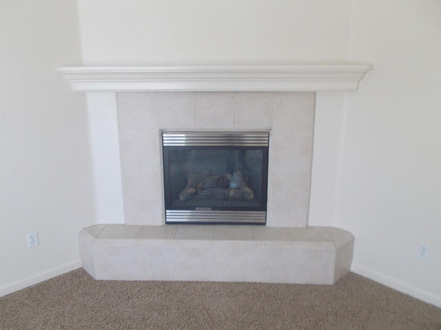 2649 Rhinestone Way Redding, CA 96001 - Photo 5 of 25 a living room with a fireplace