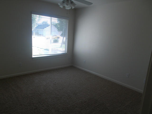 2649 Rhinestone Way Redding, CA 96001 - Photo 10 of 25 an empty room with a window
