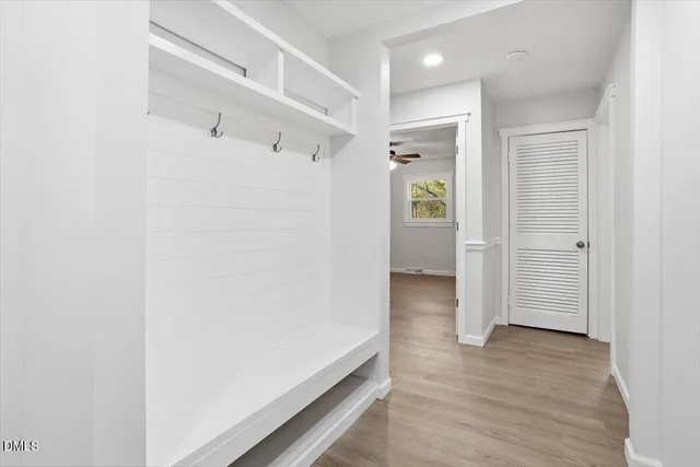 a view of a room with window and wooden floor