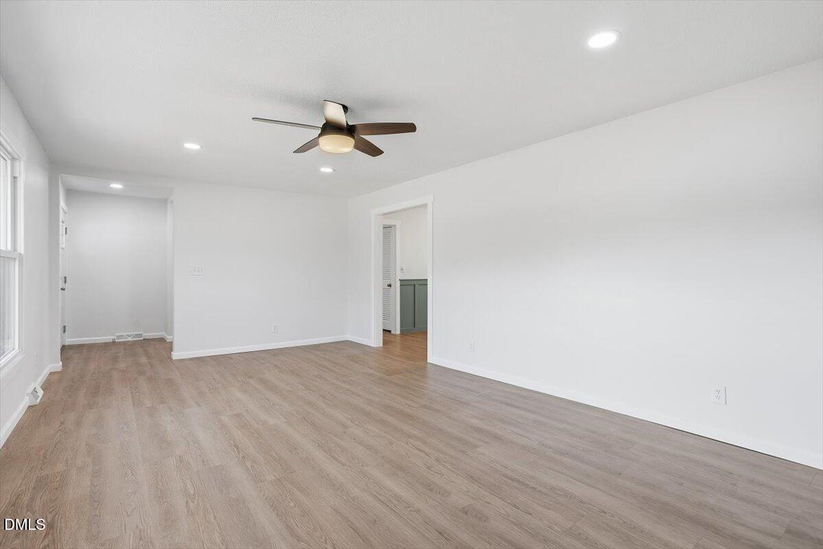 2609 Old Rte 22 Kenly, NC 27542 - Photo 15 of 43 a view of empty room with wooden floor and ceiling fan