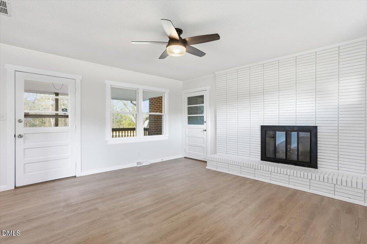 2609 Old Rte 22 Kenly, NC 27542 - Photo 17 of 43 a view of an empty room with a window and wooden floor