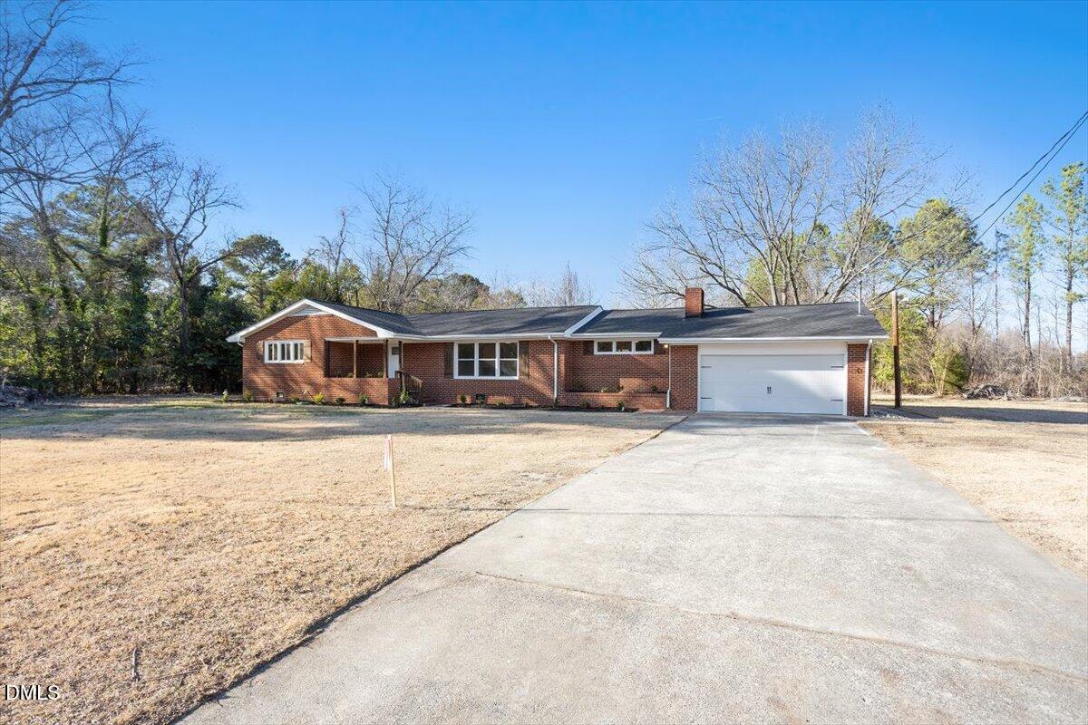 2609 Old Rte 22 Kenly, NC 27542 - Photo 38 of 43 a house with trees in the background