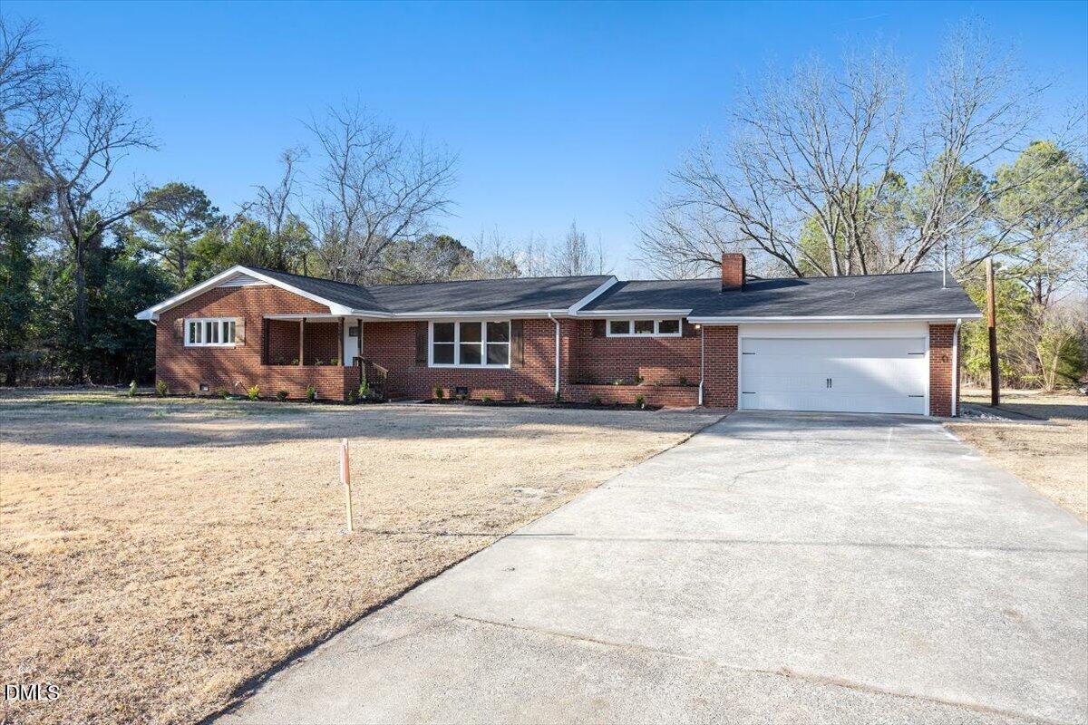 2609 Old Rte 22 Kenly, NC 27542 - Photo 39 of 43 a front view of a house with a yard and garage