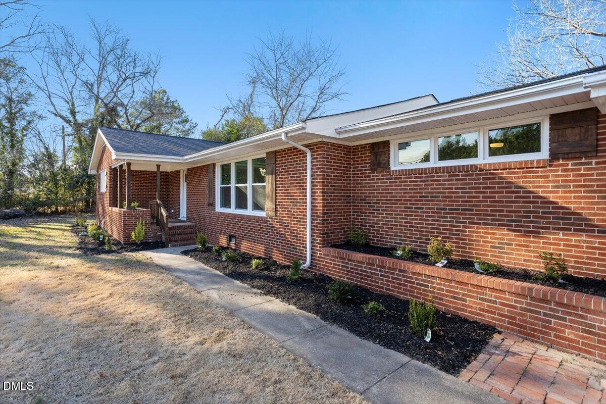 2609 Old Rte 22 Kenly, NC 27542 - Photo 41 of 43 a front view of a house with garden
