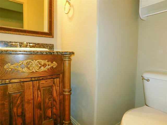 a bathroom with a toilet and sink