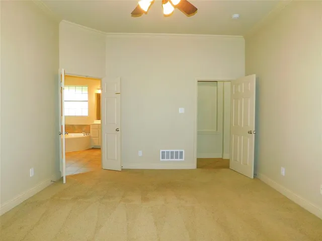 a view of a room with a en suite bathroom