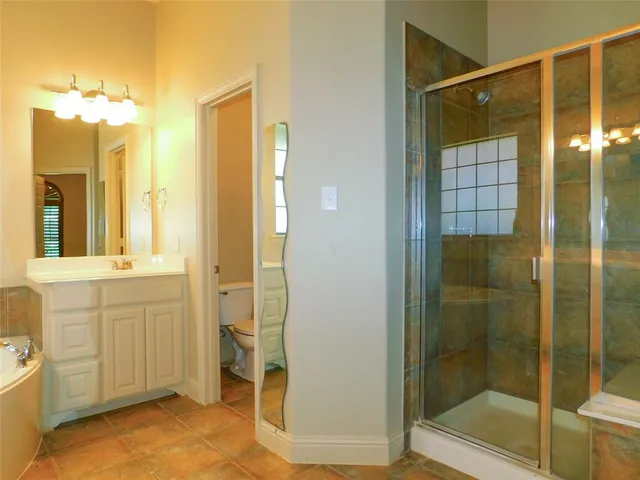 a bathroom with a shower and a sink