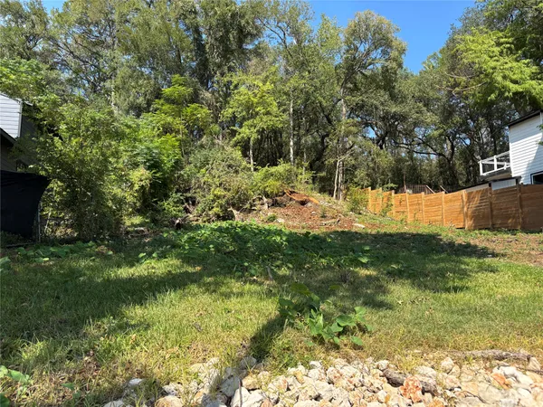 a view of a backyard of the house
