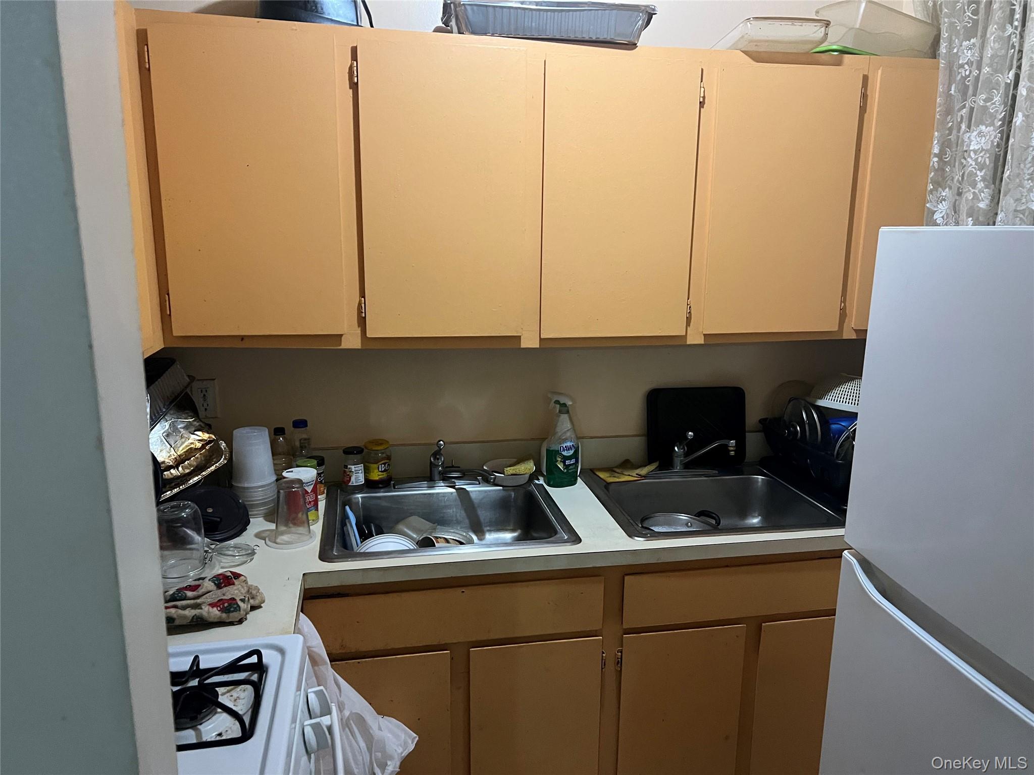 1738 Union Street, Unit 2A Brooklyn, NY 11213 - Photo 3 of 7 a kitchen with a sink a stove and cabinets