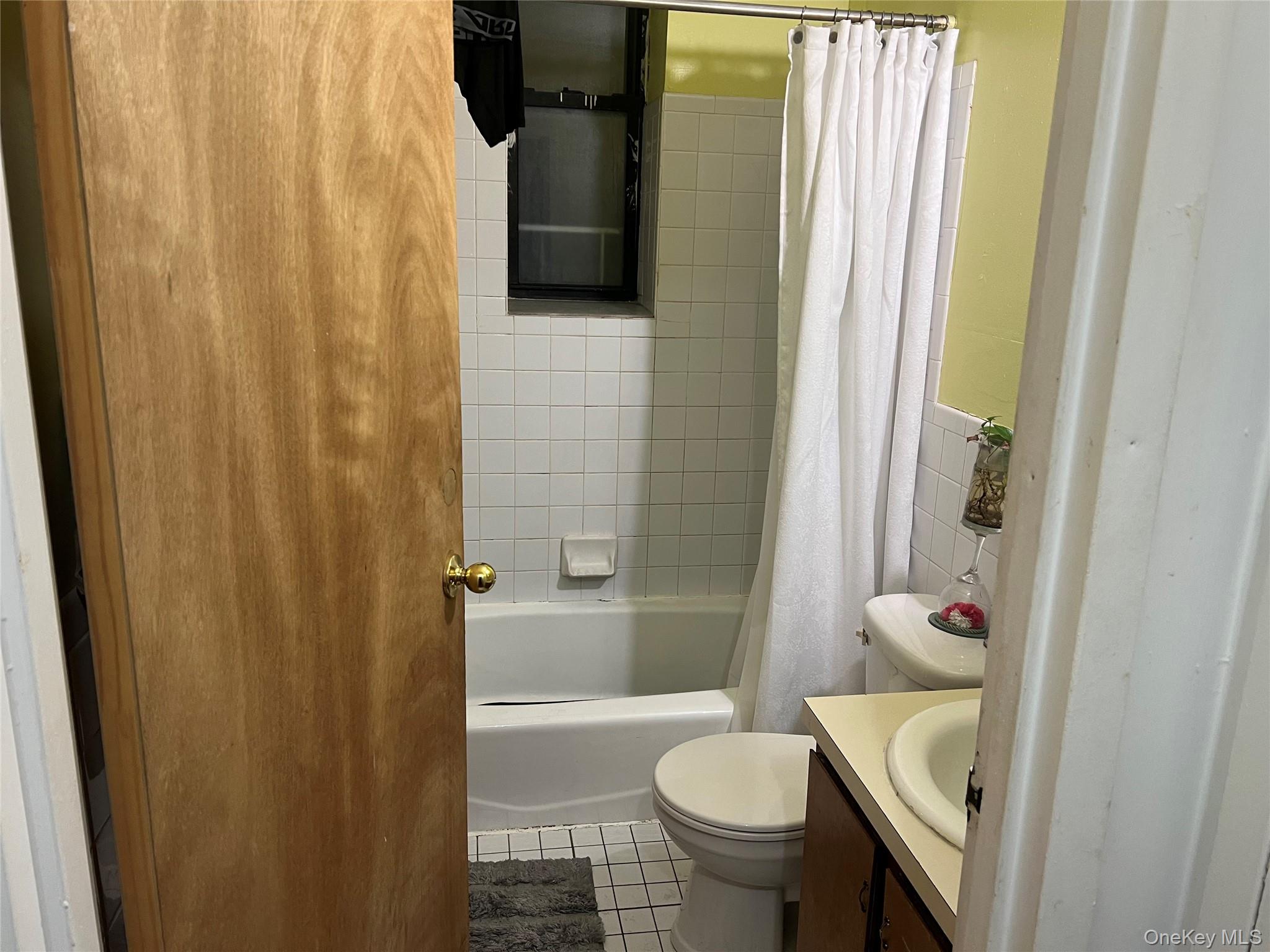 1738 Union Street, Unit 2A Brooklyn, NY 11213 - Photo 7 of 7 a bathroom with a sink toilet and shower