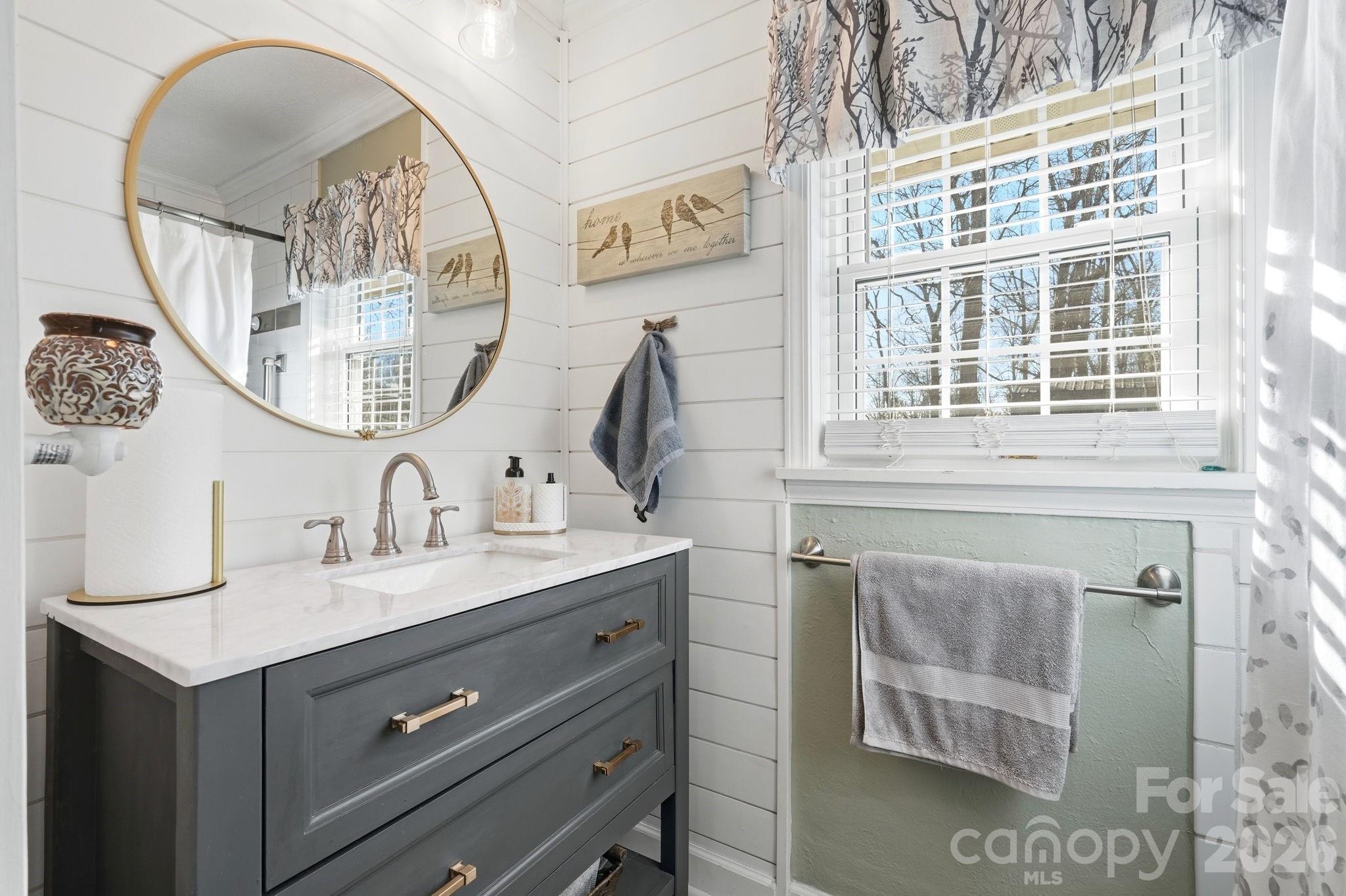 920 Ransom Road Winston-Salem, NC 27106 - Photo 17 of 35 a bathroom with a sink and a mirror