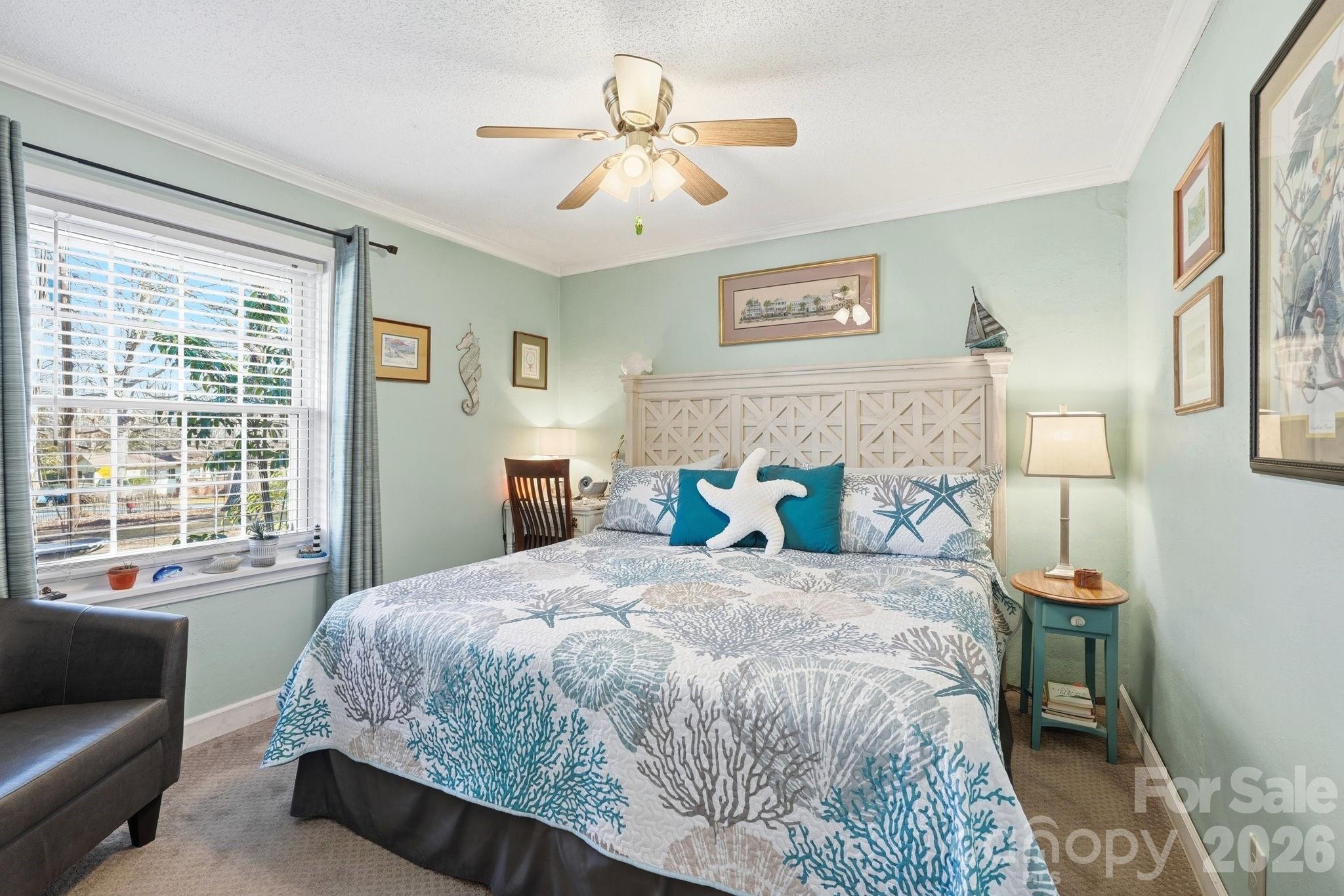920 Ransom Road Winston-Salem, NC 27106 - Photo 20 of 35 a bedroom with a large bed couch and a window