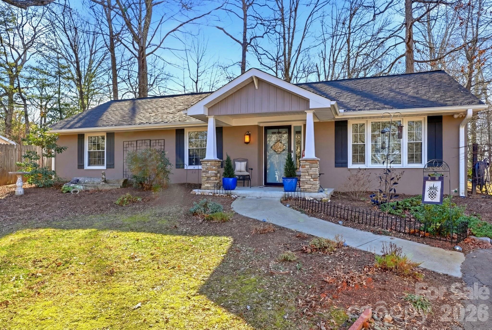 920 Ransom Road Winston-Salem, NC 27106 - Photo 2 of 35 a front view of a house with garden