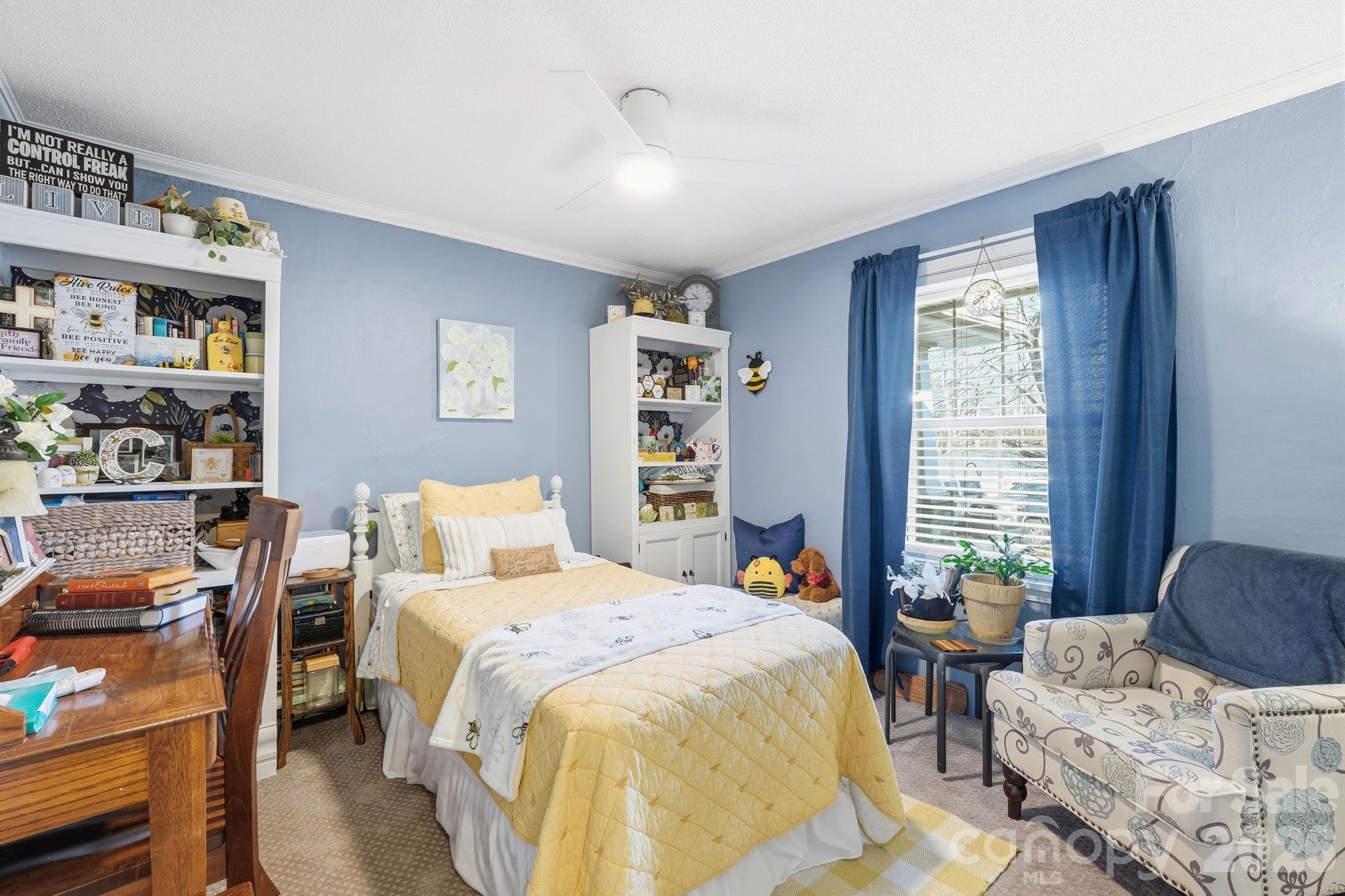 920 Ransom Road Winston-Salem, NC 27106 - Photo 22 of 35 a bedroom with a bed and a book shelf