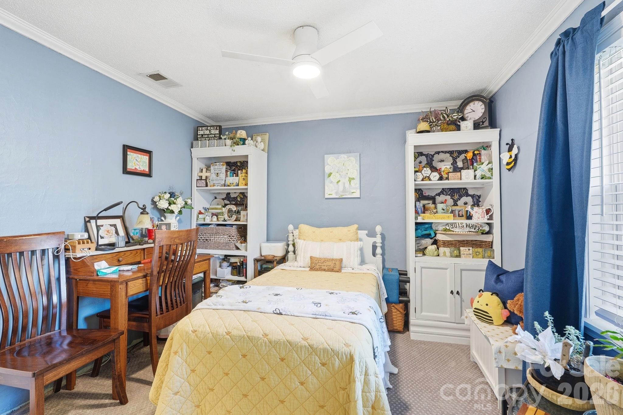 920 Ransom Road Winston-Salem, NC 27106 - Photo 23 of 35 a bedroom with furniture and a window