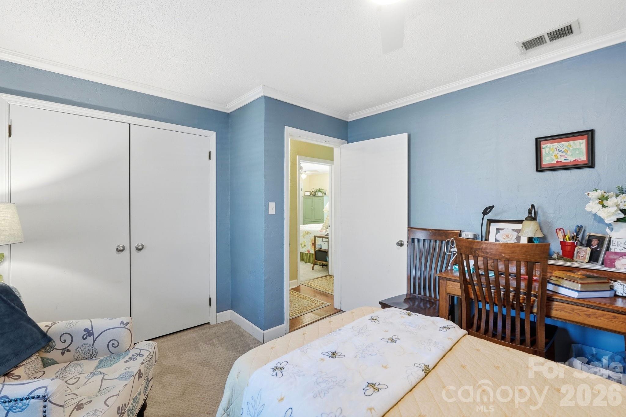 920 Ransom Road Winston-Salem, NC 27106 - Photo 24 of 35 a bedroom with a bed and wooden floor