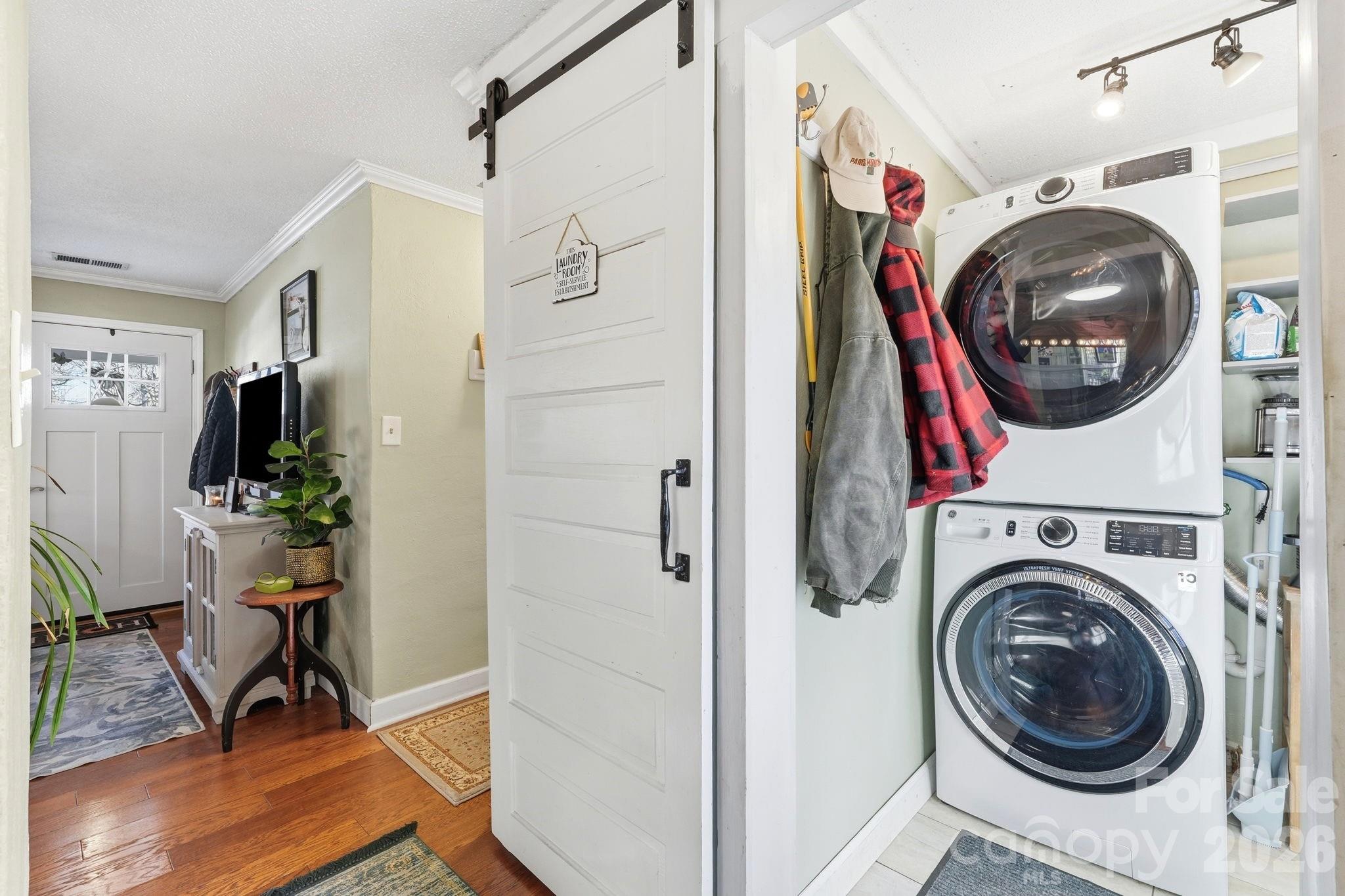 920 Ransom Road Winston-Salem, NC 27106 - Photo 26 of 35 a view of a hallway with washer and dryer