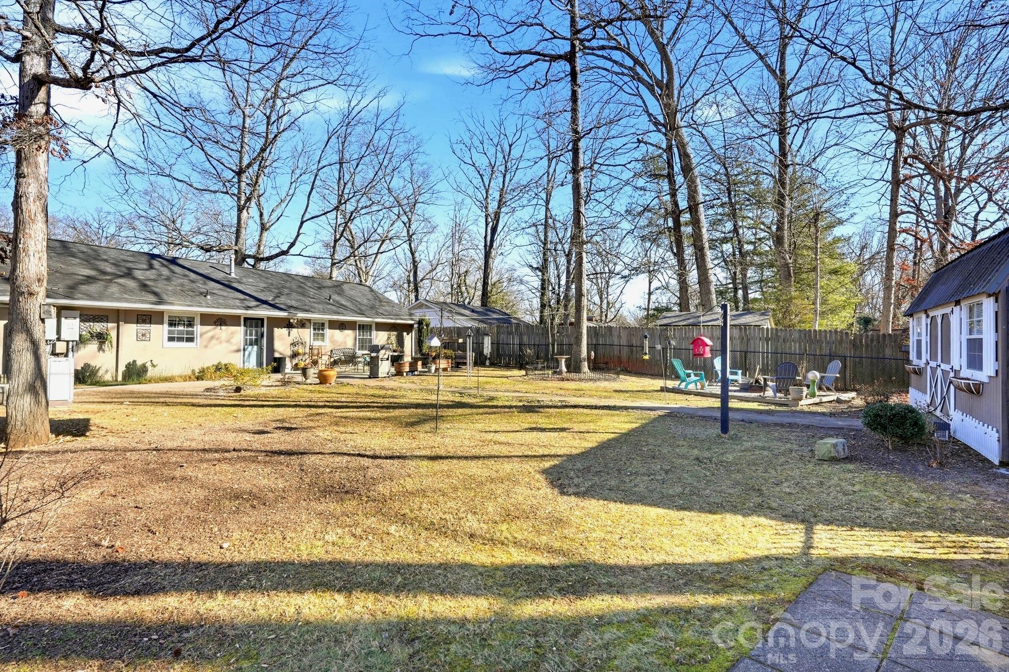 920 Ransom Road Winston-Salem, NC 27106 - Photo 30 of 35 a view of the house with swimming pool and sitting area