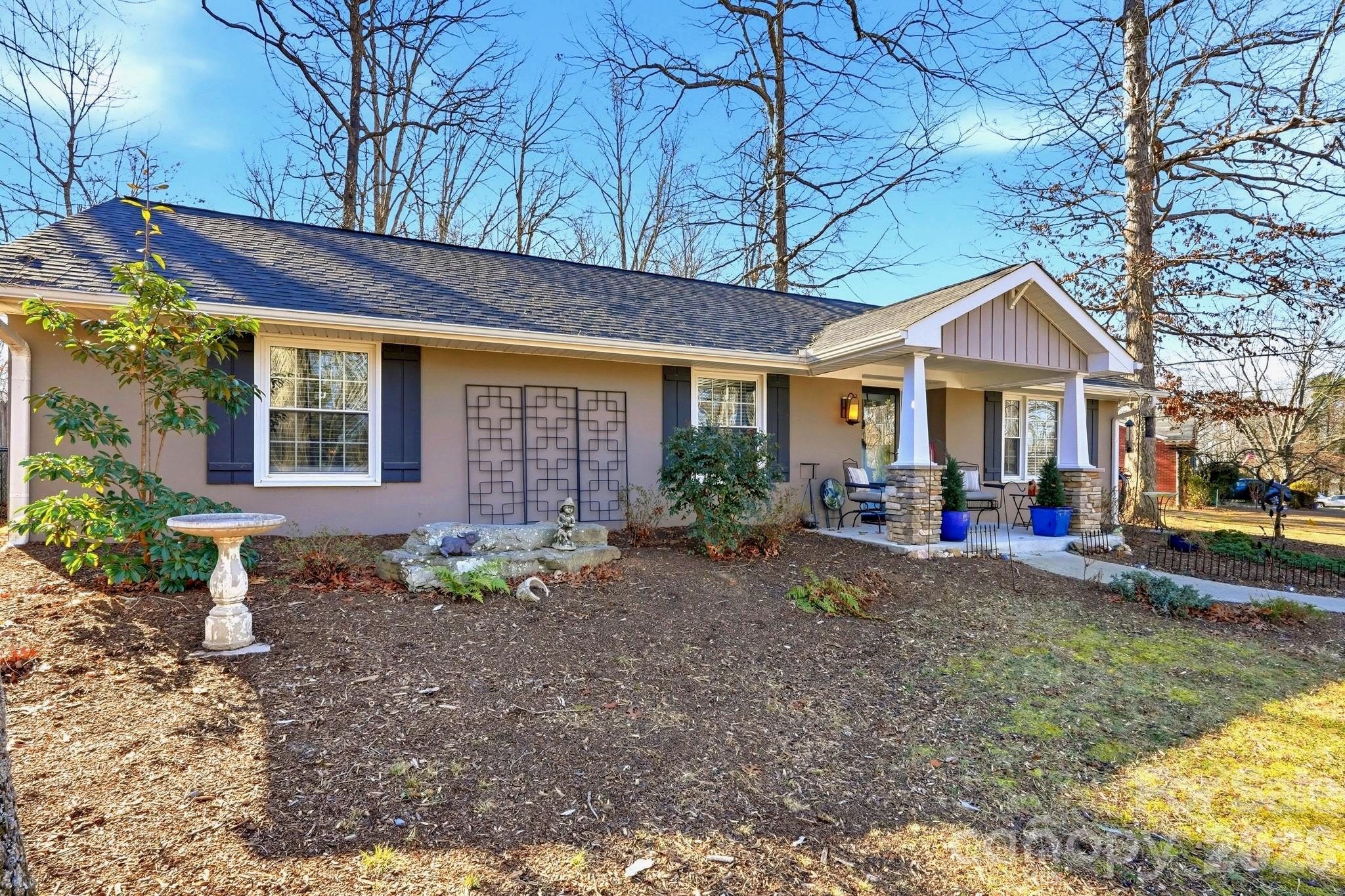 920 Ransom Road Winston-Salem, NC 27106 - Photo 3 of 35 a view of a house with a yard and sitting area