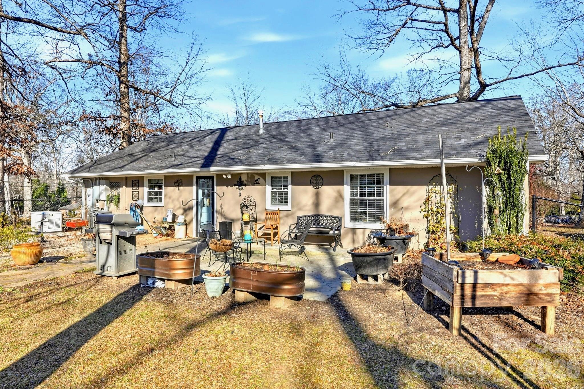 920 Ransom Road Winston-Salem, NC 27106 - Photo 32 of 35 a building outdoor space with patio furniture and potted plants
