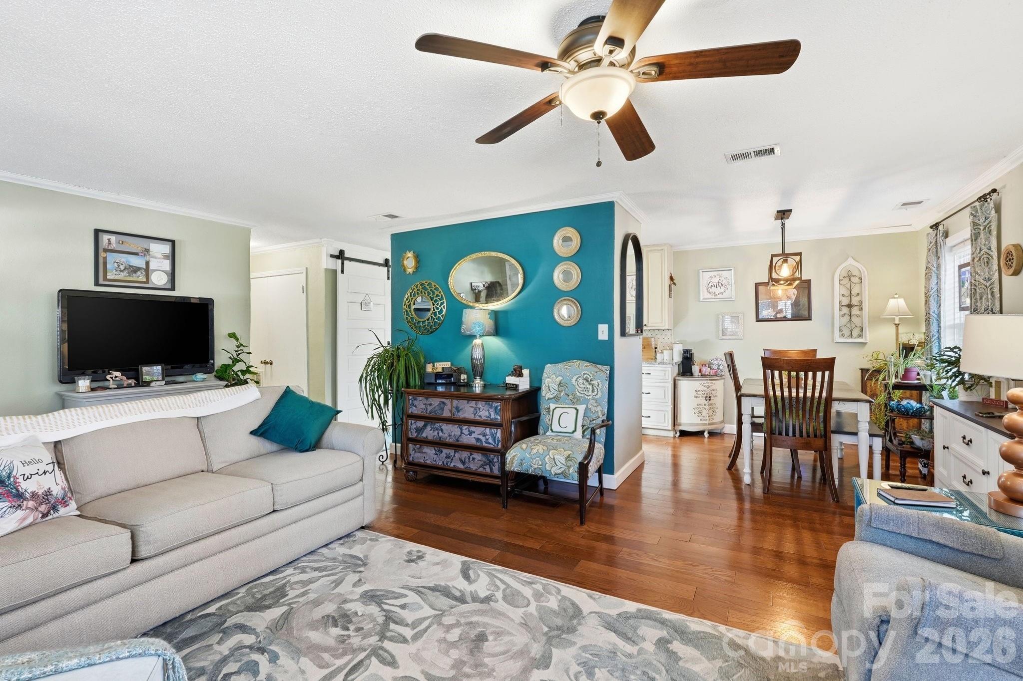 920 Ransom Road Winston-Salem, NC 27106 - Photo 6 of 35 a living room with furniture and a flat screen tv