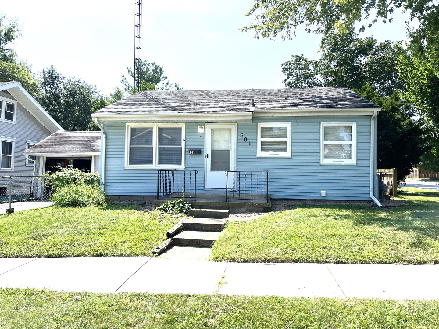 501 East University Avenue Bloomington, IL 61701 - Photo 1 of 21 a front view of a house with a yard
