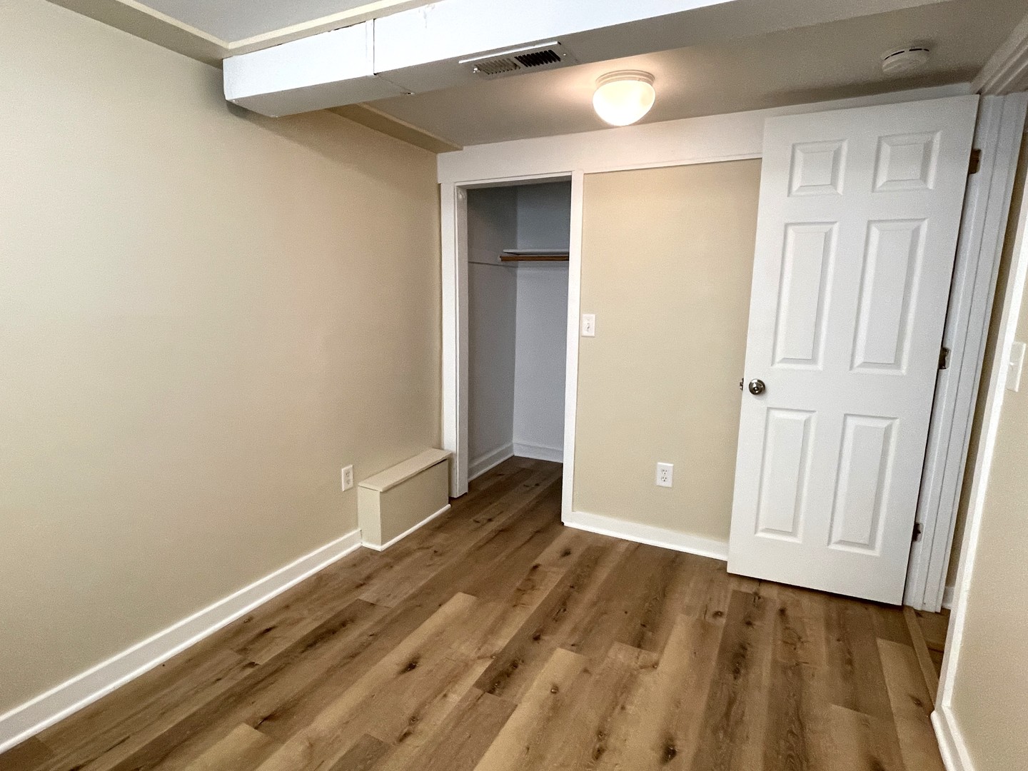 501 East University Avenue Bloomington, IL 61701 - Photo 12 of 21 a view of an empty room with wooden floor