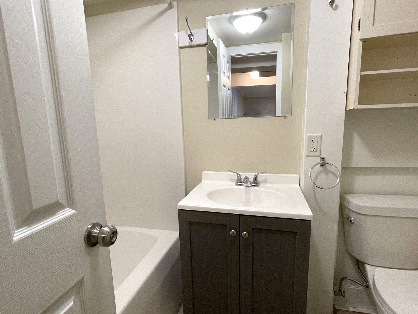 501 East University Avenue Bloomington, IL 61701 - Photo 14 of 21 a bathroom with a sink toilet and mirror