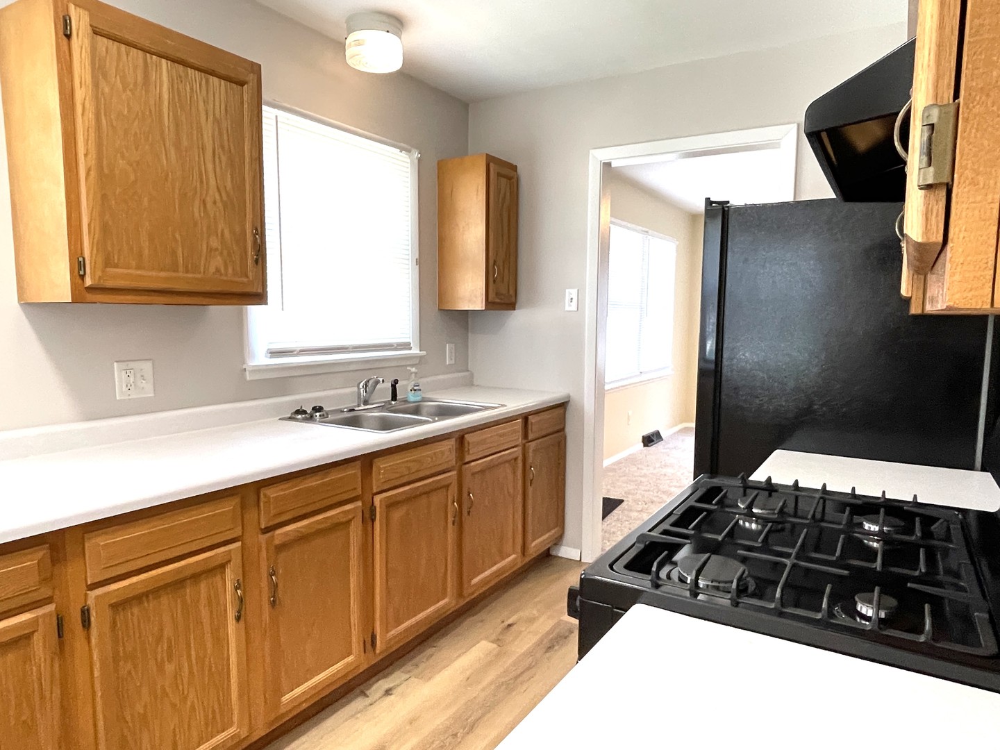 501 East University Avenue Bloomington, IL 61701 - Photo 2 of 21 a kitchen with a sink stove and cabinets