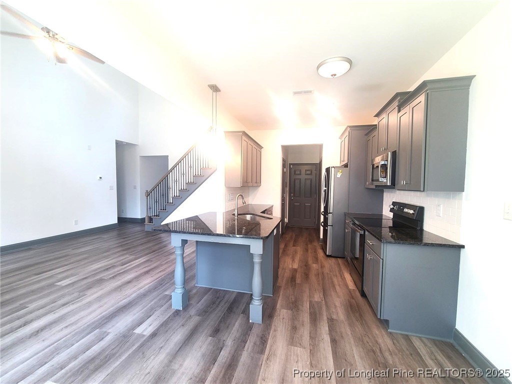 519 Hammond Farms Road Hope Mills, NC 28348 - Photo 13 of 34 a view of a kitchen from the hallway