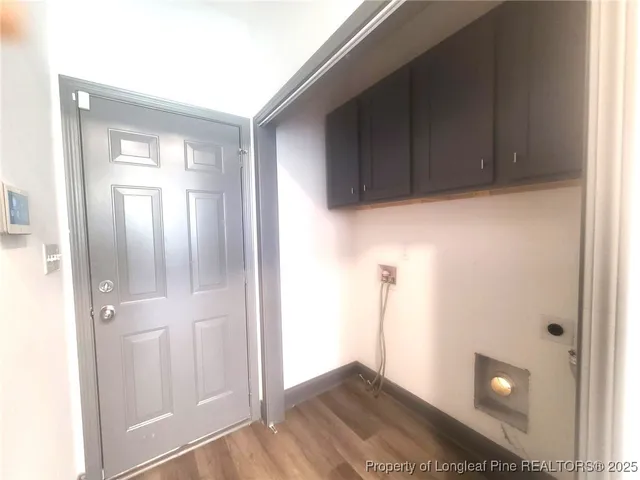 a view of a kitchen from a hallway